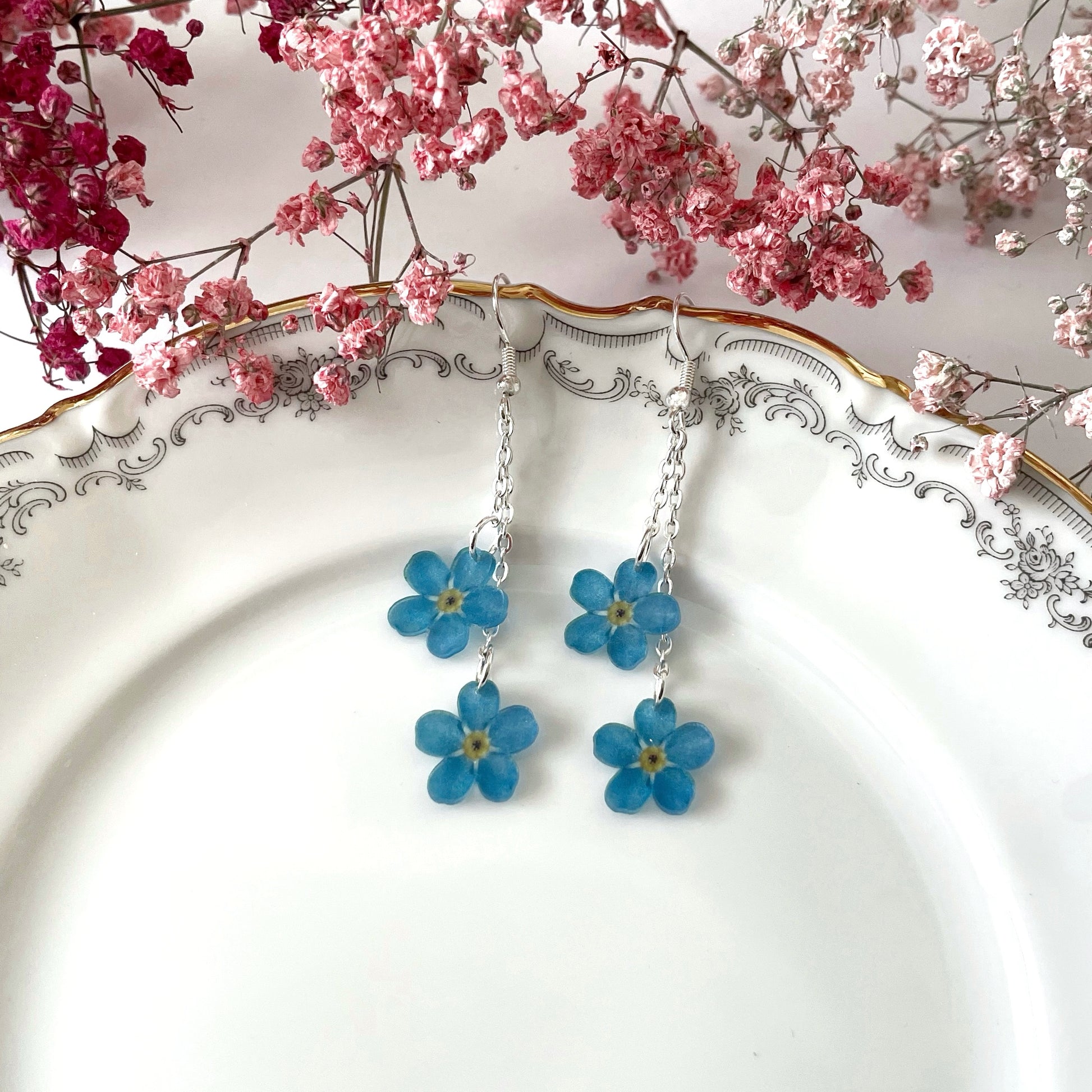 Lemmikki-korvakorut kahdella kukalla