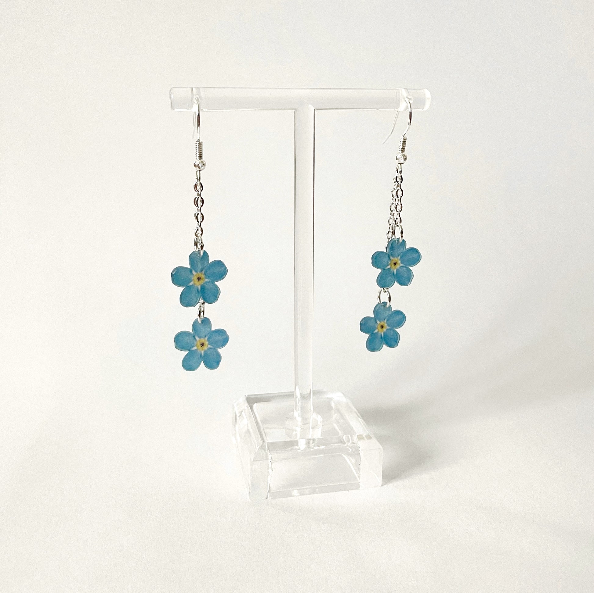 Lemmikki-korvakorut kahdella kukalla