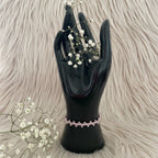 Vaaleanpunainen rannekoru