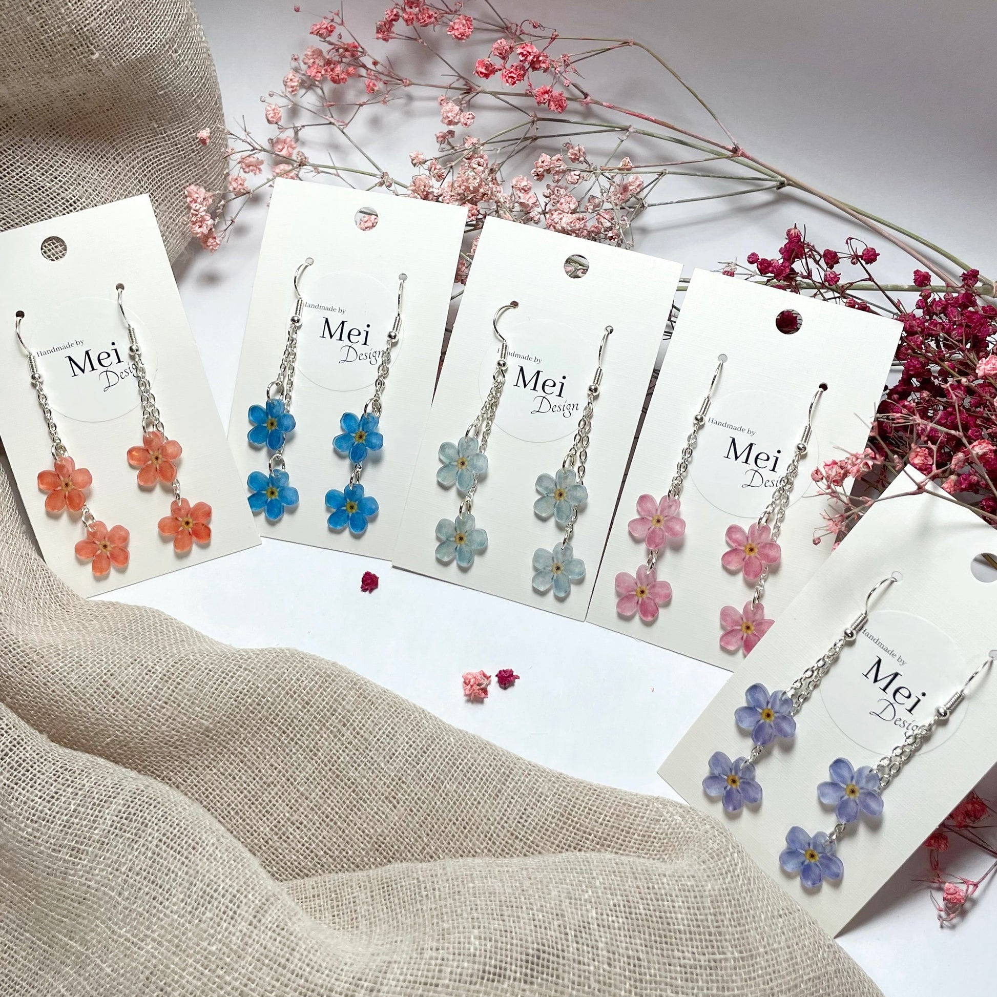 Lemmikki-korvakorut kahdella kukalla