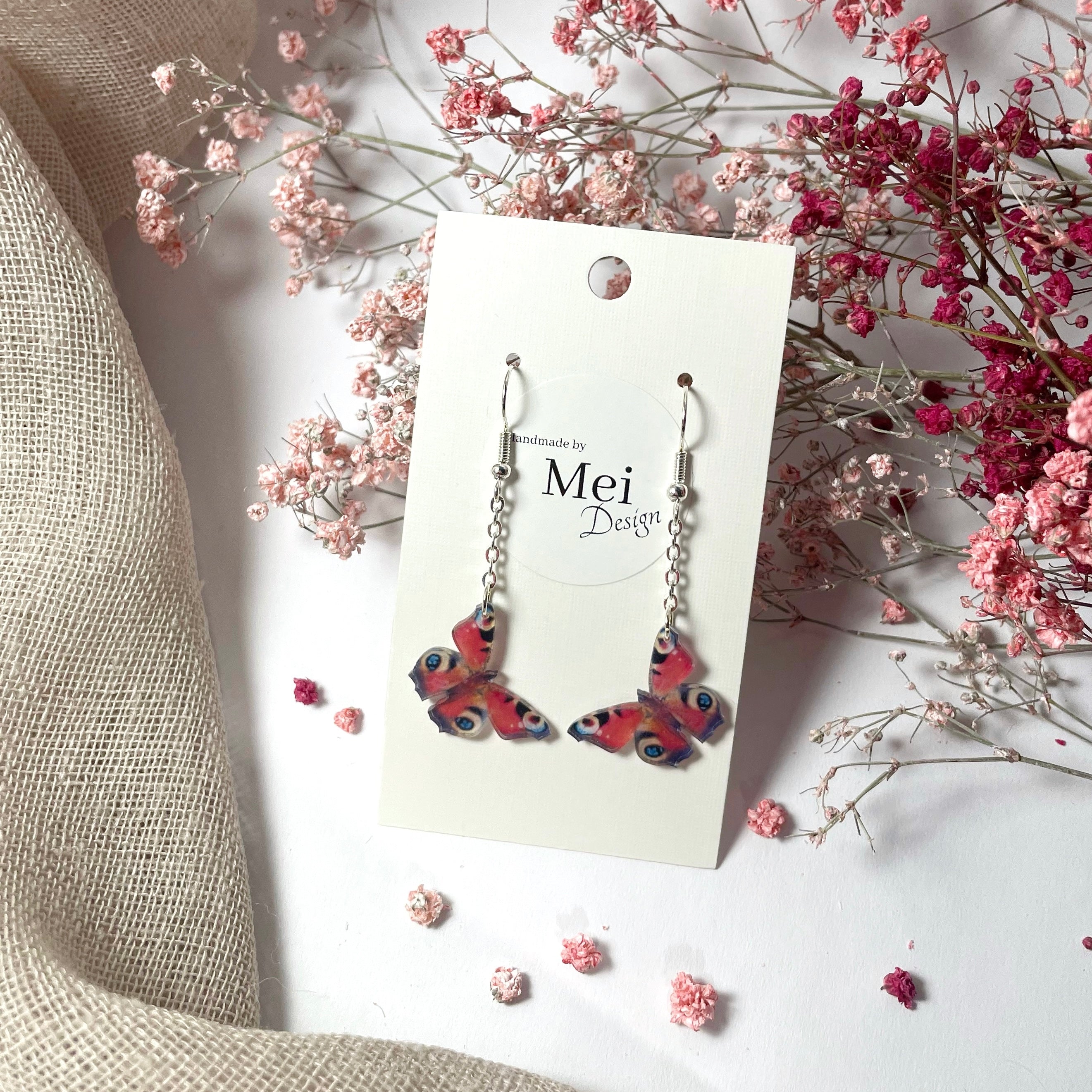 Neitoperhonen-korvakorut