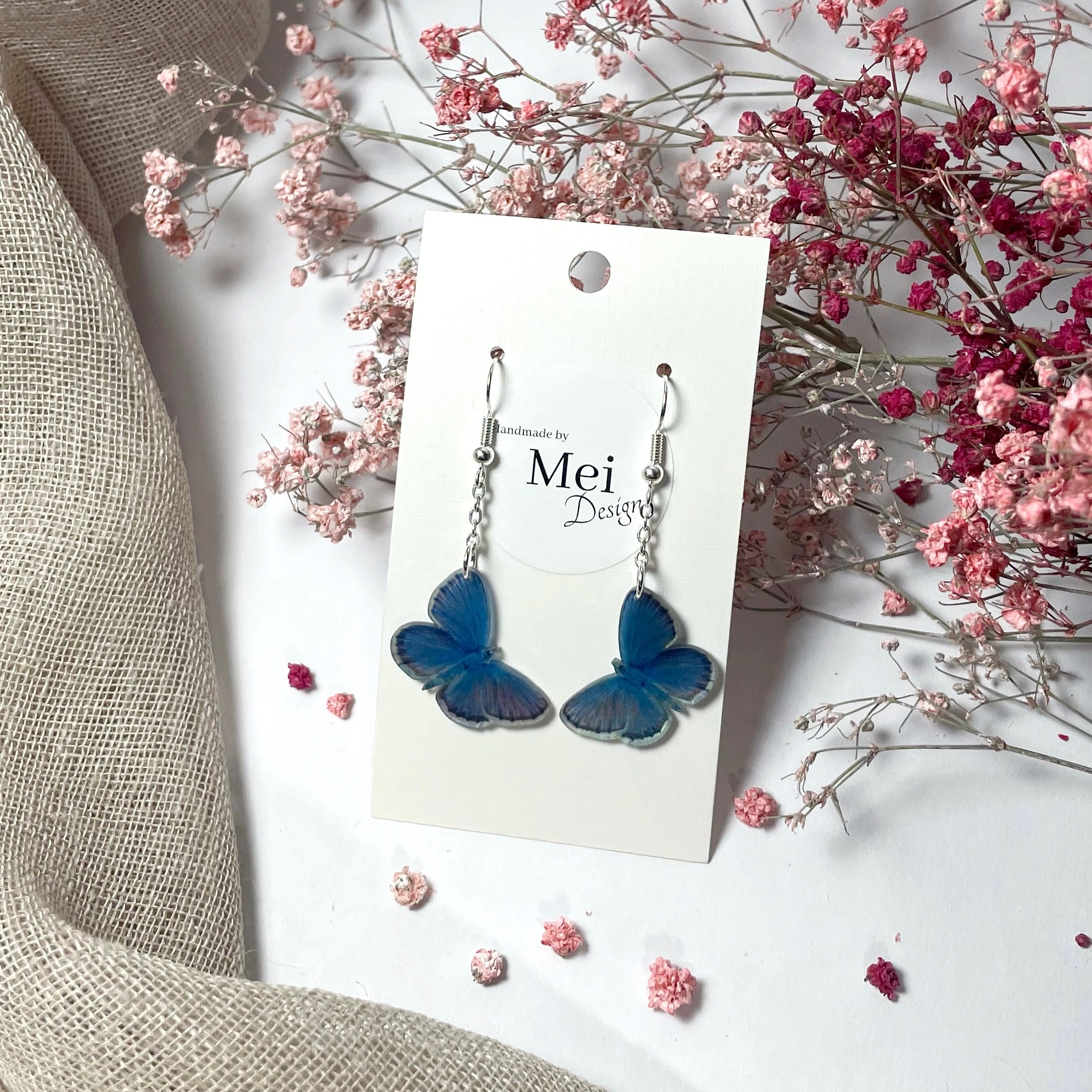 Kangassinisiipi-korvakorut