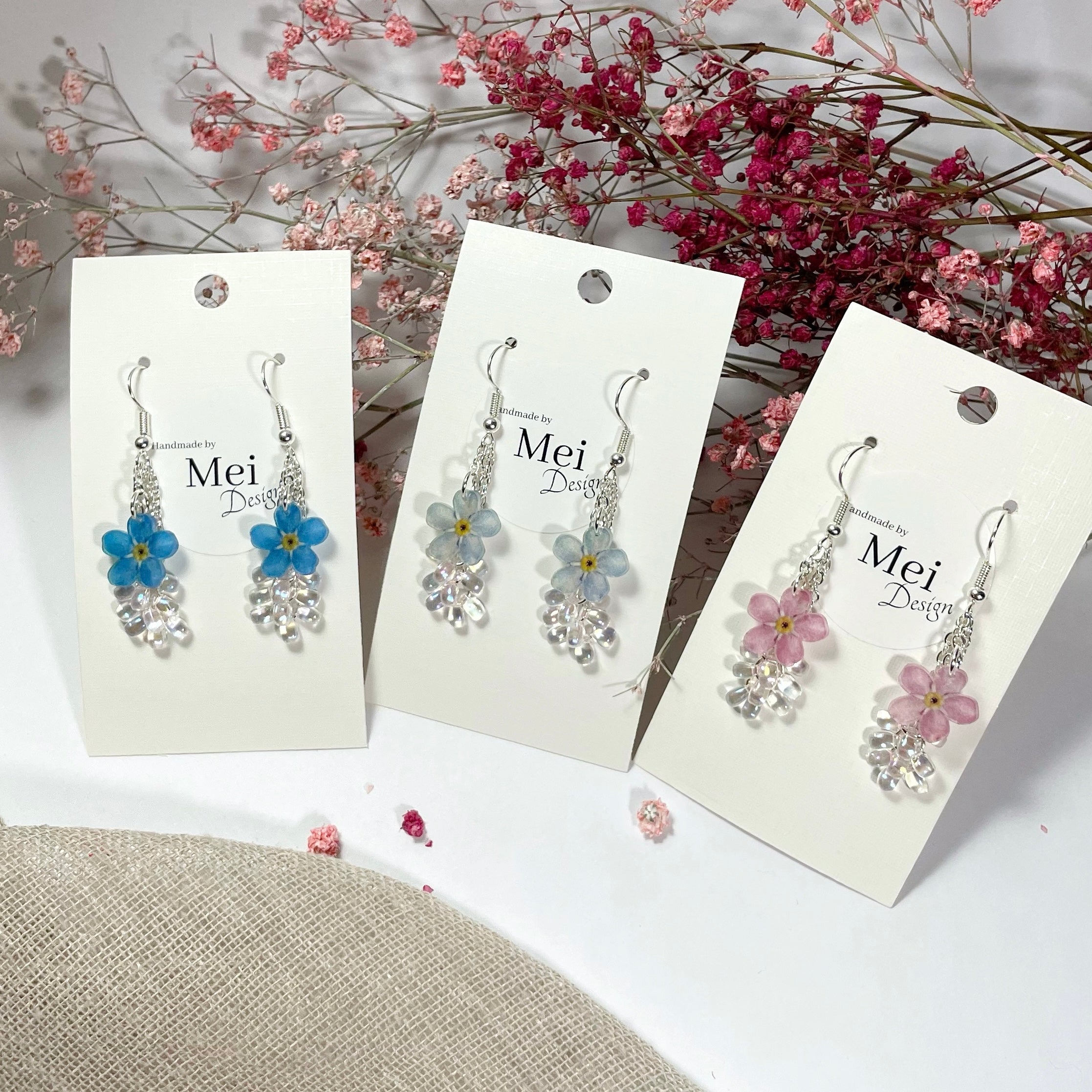 Yhden kukan lemmikki-korvakorut helmillä