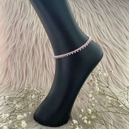 Vaaleanpunainen nilkkakoru